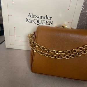 Alexander McQueen handbag show the bag or clutch 100% authentic
